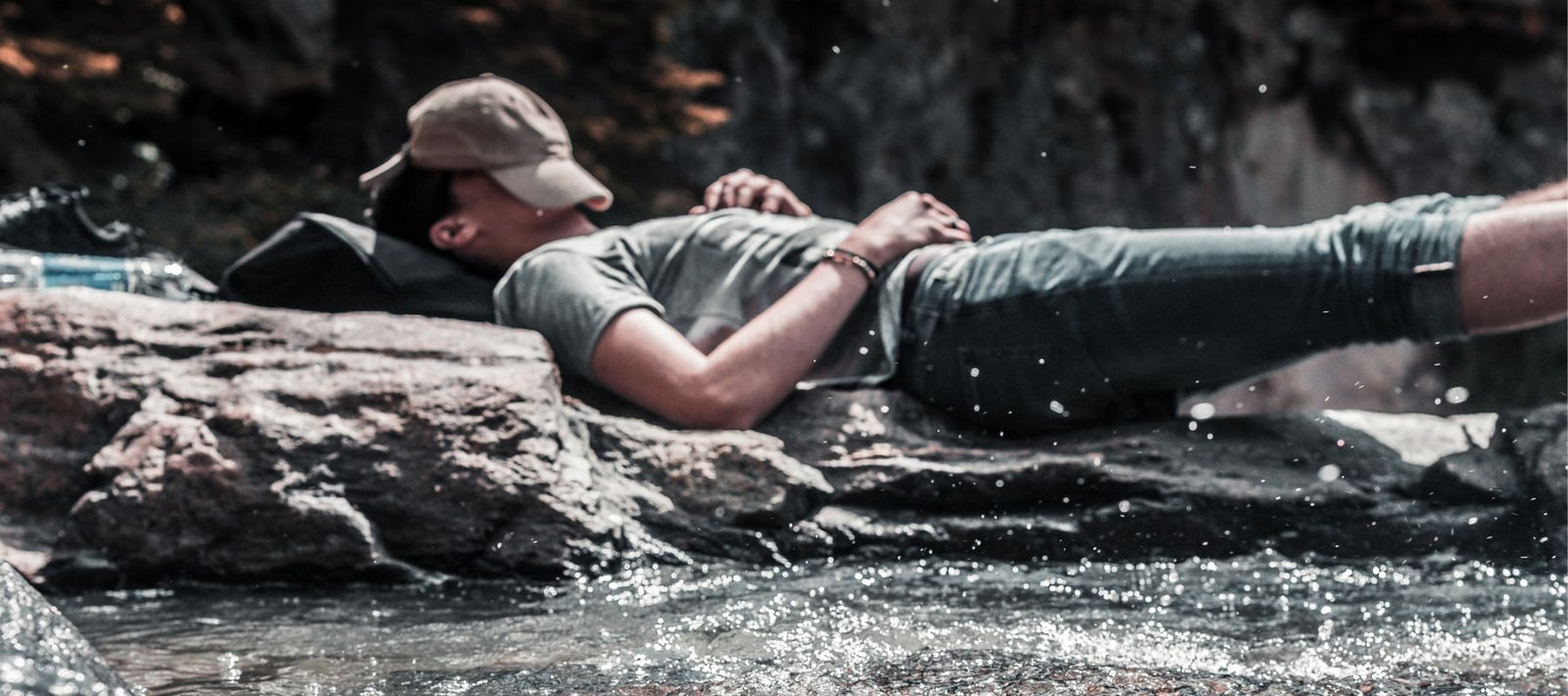 man napping by riverside
